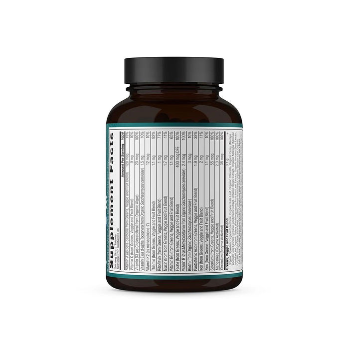 A brown supplement bottle with a black cap features a detailed white label listing the Organic Super Greens + Multivitamins by Ancient Nutrition. It displays vitamins, minerals, and nutrition facts in black text with teal accents, promoting healthy digestion against a plain white background.