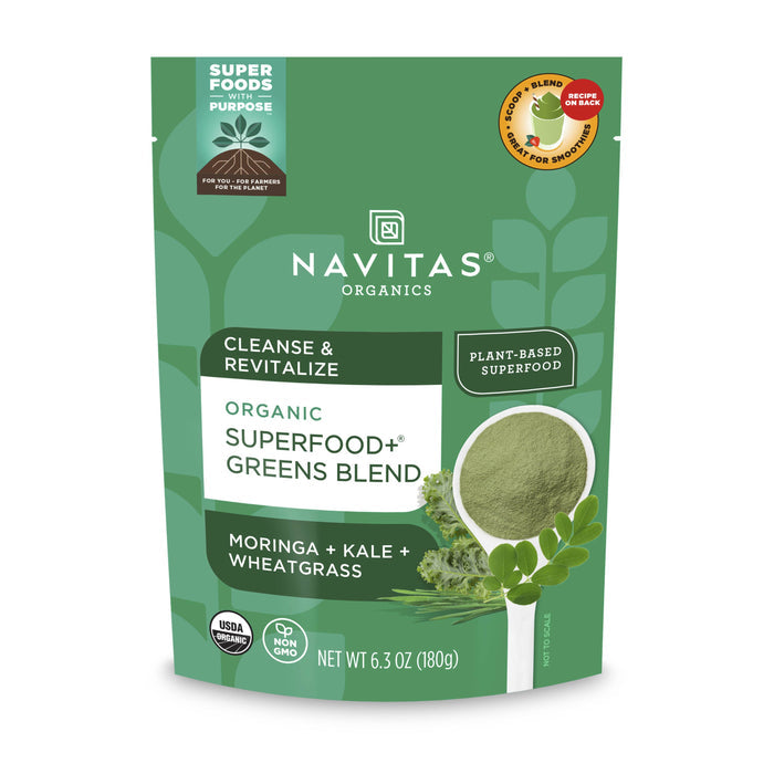 Navitas Organics Organic Superfood+ Greens Blend, in a green package, offers detox support from moringa, kale, and wheatgrass. The label emphasizes Cleanse & Revitalize, highlighting its organic, plant-based ingredients. It bears USDA organic and non-GMO seals. Weight: 6.3 oz (180g).