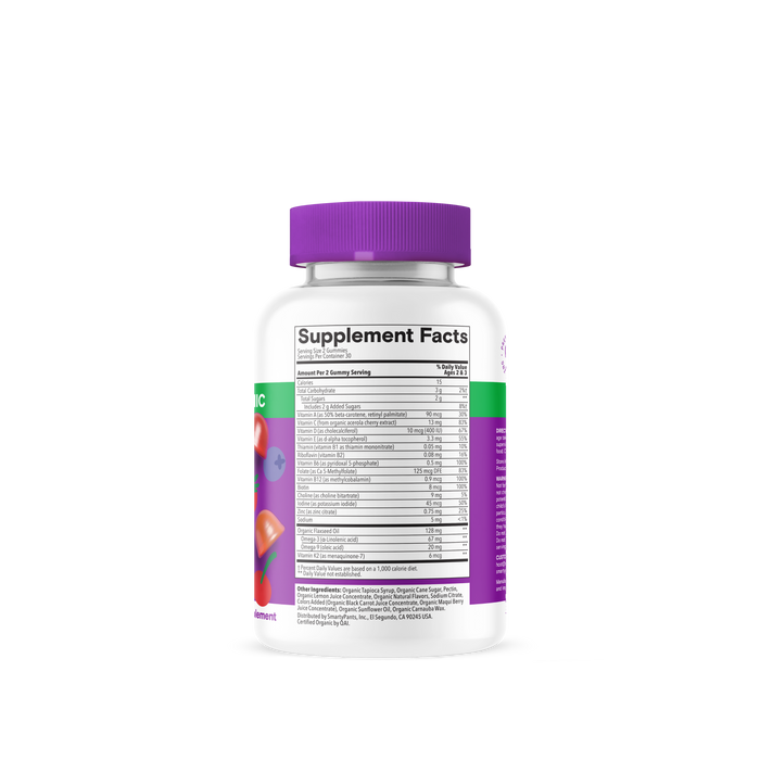 A bottle of SmartyPants Organic Toddler Formula with a purple cap is shown from the back, displaying the Supplement Facts and ingredients list. The label features colorful fruit and vegetable graphics, emphasizing that these toddler vitamins are specially formulated to help support your little one’s nutritional needs.