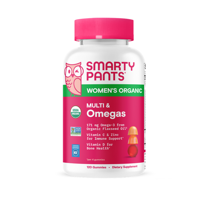 A bottle of SmartyPants Organic Women’s Multi & Omegas Gummies features a pink cap and label emphasizing Omega-3, vitamin C, zinc, and vitamin D3. This organic women’s multivitamin provides 120 vegetarian gummies per bottle, delivering essential nutrients in a tasty omega-3 gummy form.
