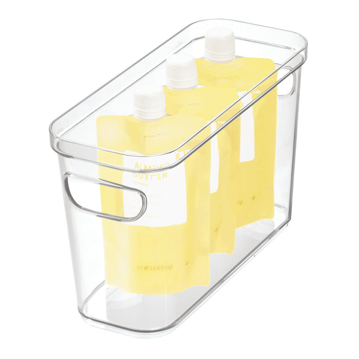 Three yellow spout pouches stand in an iDesign Organizer Bin with Handles made from recycled plastic, showcasing the liquid or gel contents within a clear modular storage solution.