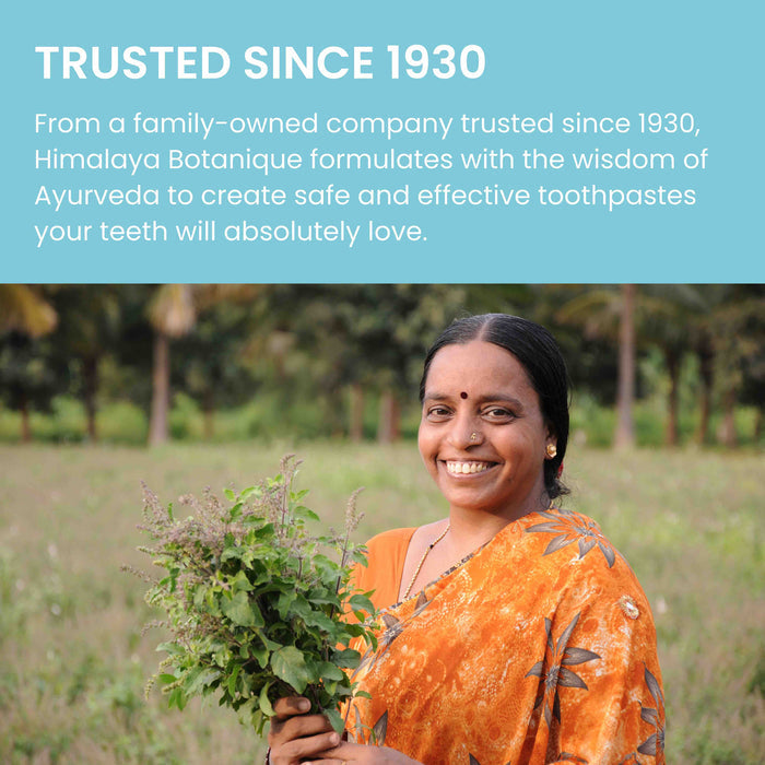 A woman in a vibrant orange sari smiles while holding a bunch of green herbs. The background shows a lush, outdoor setting. The text above her reads, "TRUSTED SINCE 1930. From a family-owned company trusted since 1930, Himalaya Botanique formulates with the wisdom of Ayurveda to create safe and effective toothpastes your teeth will absolutely love.