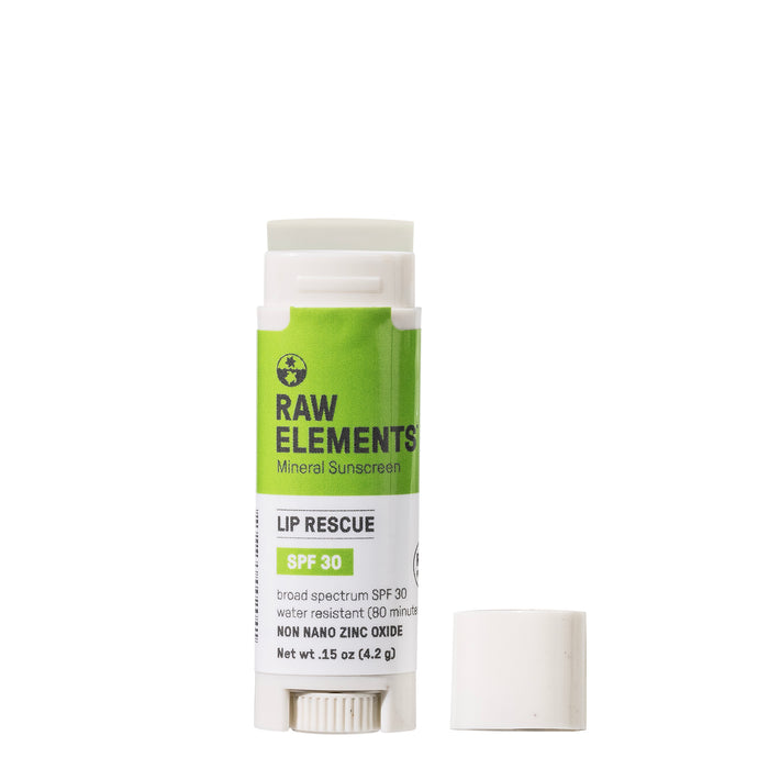 A tube of Raw Elements Outdoor Lip Rescue - SPF 30 in white and green is shown with the cap off. Made from all-natural ingredients, it highlights broad-spectrum protection, water resistance, and non-nano zinc oxide for excellent lip care.