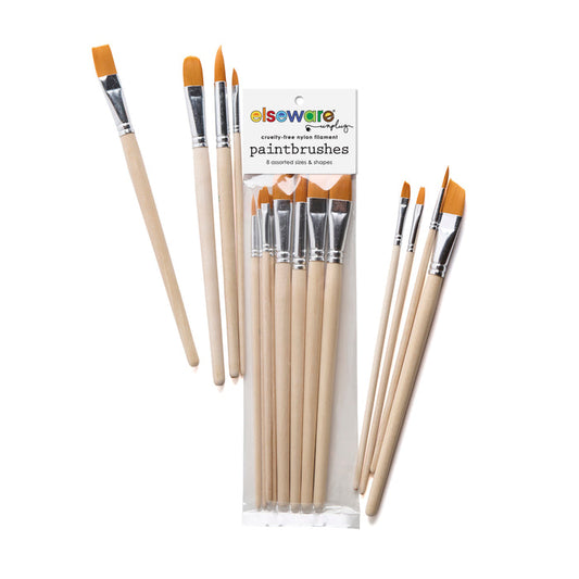 A set of eight cruelty-free Elseware Unplug Paintbrushes with wooden handles and orange nylon bristles, packed in a clear bag labeled "Paintbrush Set"; four brushes shown outside the package.