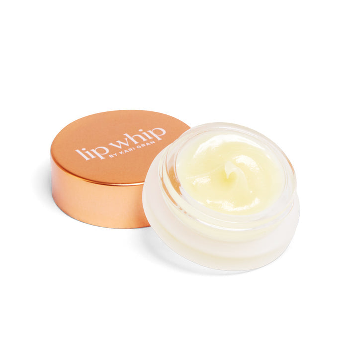 A small open jar of Kari Gran Peppermint Lip Whip Treatment Balm, an organic lip balm in light yellow, is shown with a copper-colored lid beside it. The creamy and smooth balm is ideal for natural lip care.