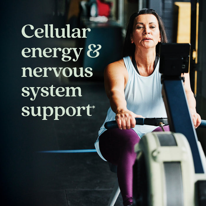 A woman in athletic wear uses a rowing machine at the gym. Text on the image reads, Perfect Energy™ Multivitamin by New Chapter—cellular energy & nervous system support* with B12, B6, and D3.
