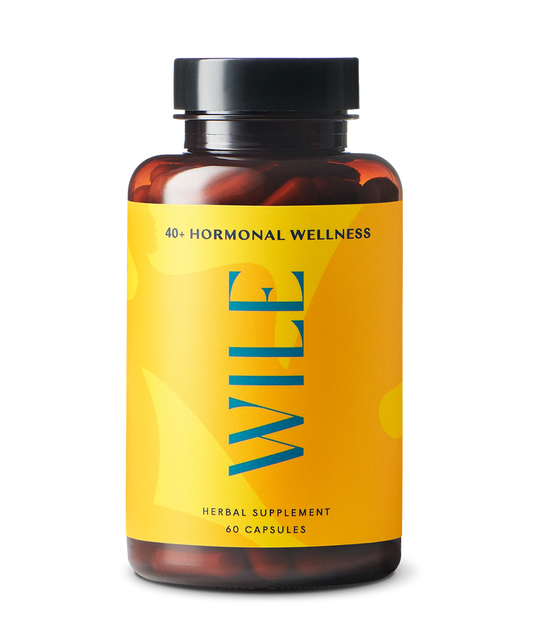 A bottle of WILEs Perimenopause Support herbal supplements features a yellow label with blue text, contains 60 capsules, and is formulated for those over 40 to naturally support hormonal wellness during perimenopause and boost stress resilience.