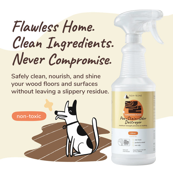 A kin+kind Pet Pee + Stain + Odor Remover Spray is placed next to a dog illustration on wooden flooring. The words Flawless Home. Clean Ingredients. Never Compromise. highlight its plant-based, non-toxic citrus formula that effectively eliminates odors.