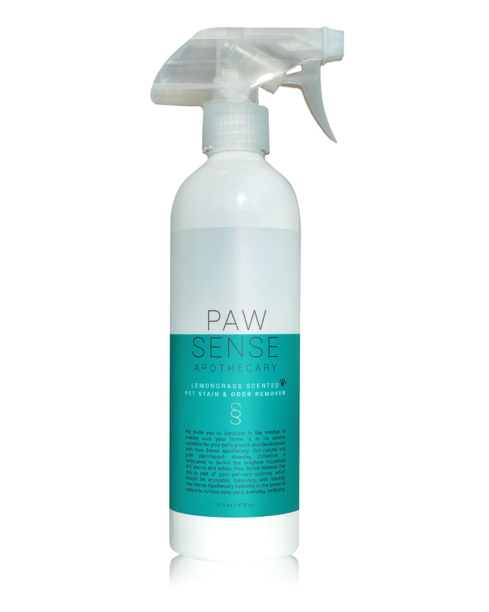 The Paw Sense Apothecary white spray bottle with a transparent trigger, featuring a teal label reading Lemongrass Scented Pet Stain & Odor Remover, is crafted with natural essential oils and holds 16 oz, making it a premium choice in pet grooming supplies.