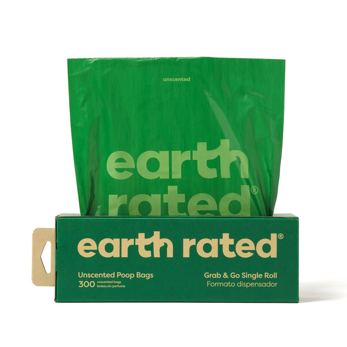 A 300-count box of Earth Rateds Pet Waste Bags, Large Single Roll Refill, features leak-proof unscented bags made from recycled plastic. The green box has a front cut-out displaying the roll, with Grab & Go Single Roll and Formato dispensador text.