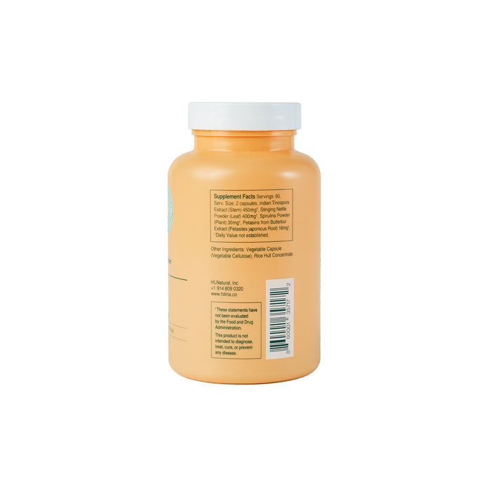 A rear view of Pollen Defense, an orange Hilma bottle with a white cap, shows a label with supplement facts, ingredients, barcode, serving size, and nutritional info for natural herb-based sinus support.