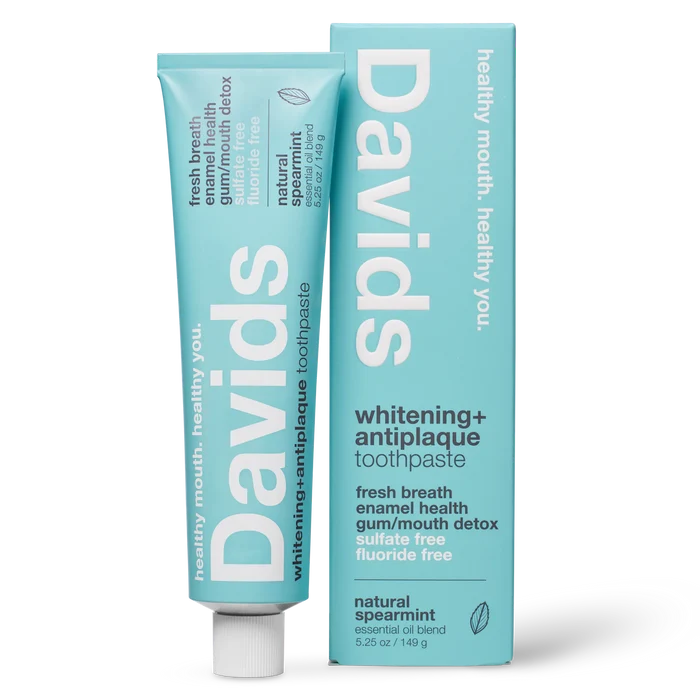 A tube and box of Davids Premium Toothpaste - Whitening + Antiplaque in natural spearmint flavor, featuring a light blue design with white text highlighting benefits such as enamel health, detox, and fluoride-free. This EWG Verified toothpaste is a natural whitening formula, crafted as a fluoride free option for a cleaner, healthier smile.