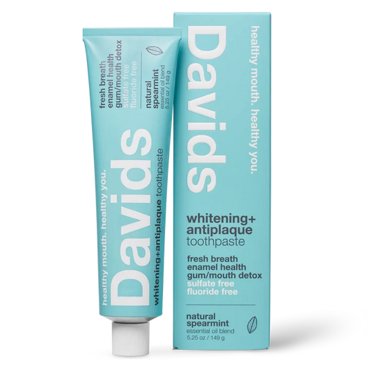 A tube and box of Davids Premium Toothpaste - Whitening + Antiplaque in natural spearmint flavor, featuring a light blue design with white text highlighting benefits such as enamel health, detox, and fluoride-free. This EWG Verified toothpaste is a natural whitening formula, crafted as a fluoride free option for a cleaner, healthier smile.