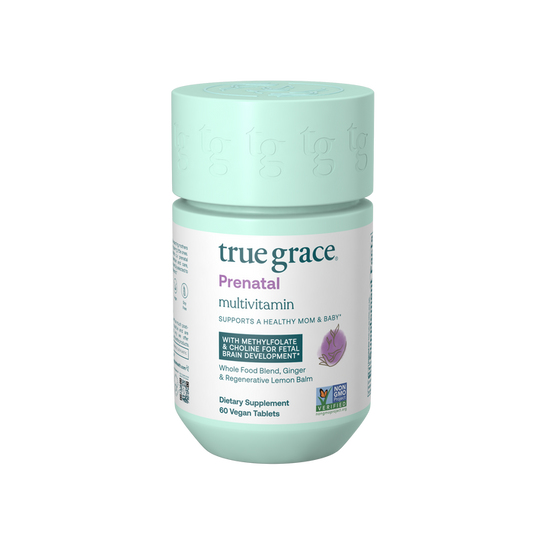 A jar of True Grace Prenatal Multivitamin features a teal cap and label highlighting support for mom and baby with methyl folate, DHA/EPA, and Choline. It holds 60 vegan tablets, is Non-GMO Project Verified, includes Vitamin D3, and promotes healthy brain development.