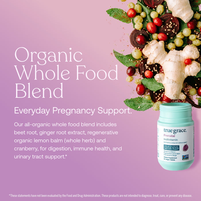 A bottle of True Grace Prenatal Multivitamin Tablets spills whole foods like ginger, cranberries, and greens on a pink backdrop, with text highlighting support for pregnancy, digestion, immune health, and urinary health with vitamin D3.*.