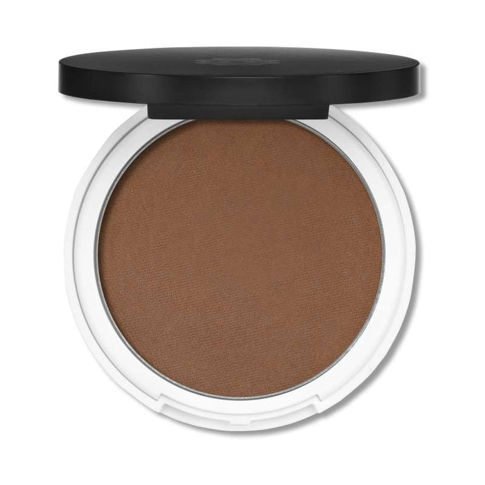 Lily Lolos Pressed Bronzer features a black-lidded compact with a white base, revealing natural mineral powder inside. It provides a smooth, matte finish for a sun-kissed glow.