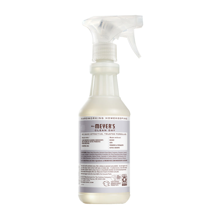 A bottle of Mrs. Meyers Probiotic Daily Shower Spray Cleaner with a lavender scent sits on a white background, its label detailing product features and usage tips, ideal for removing soap scum and refreshing surfaces.