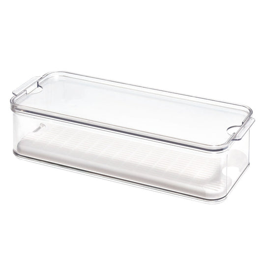 The iDesign Produce Fridge Bin, crafted from recycled BPA-free plastic, is a transparent rectangular container with a clear lid featuring integrated handles for easy lifting and includes a white draining tray to efficiently store produce.