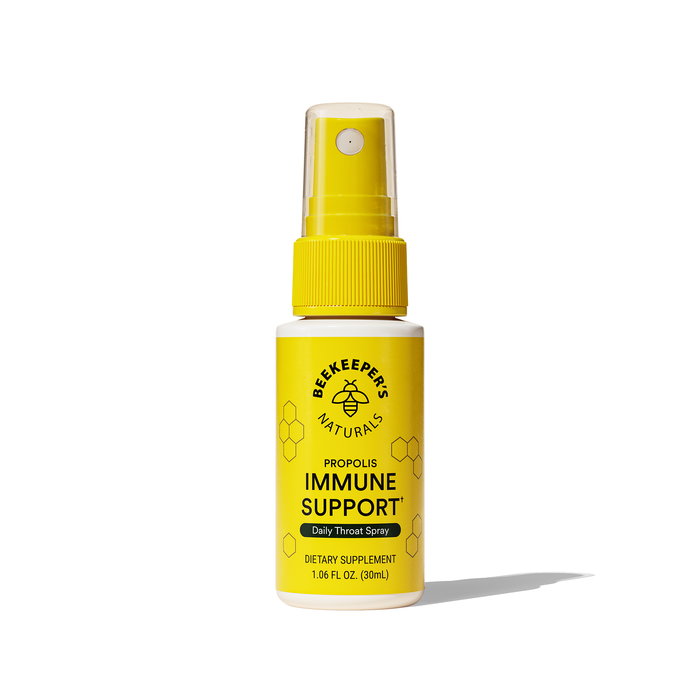 The yellow Propolis Immune Support Throat Spray by Beekeepers Naturals offers daily immune support in a 1.06 fl oz bottle. Featuring a bee logo and easy-to-use nozzle, this dietary supplement boosts immunity with every spray for optimal throat care.