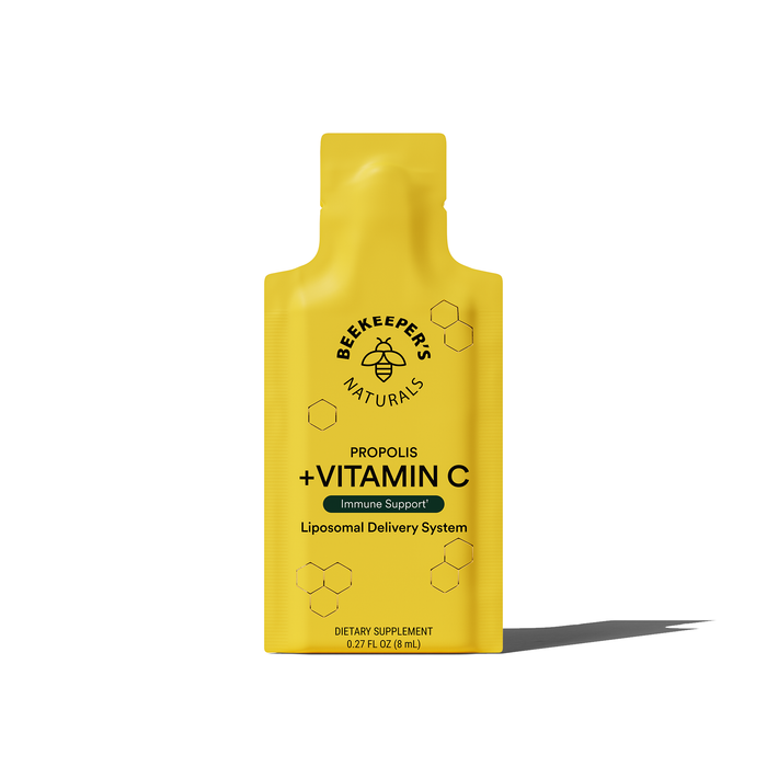 A yellow packet of Beekeepers Naturals Propolis Liposomal and Vitamin C, featuring a hexagonal pattern and bee logo, offers Immune Support with a Liposomal Delivery System in 0.27 fl oz (8 mL) for your wellness journey.