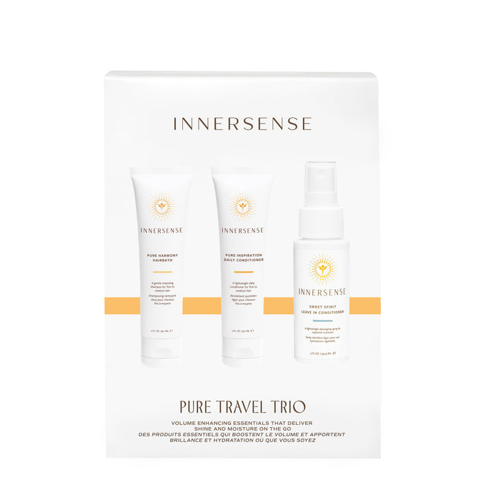 White box packaging displays three Innersense Organic Beauty products: Pure Harmony Hairbath, Pure Inspiration Daily Conditioner, and Sweet Spirit Leave In Conditioner. Text reads “Pure Travel Trio.” Clean beauty for weightless moisture.