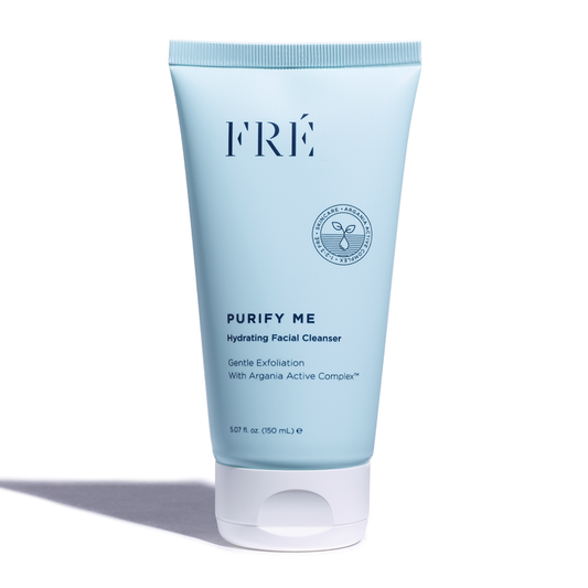 A light blue tube of FRÉ Skincares PURIFY ME Hydrating Facial Cleanser with a white cap features the Argania Active Complex™. It gently exfoliates and minimizes pores, delivering 150 mL (5.07 fl oz) of skincare benefits, casting a subtle shadow in front.