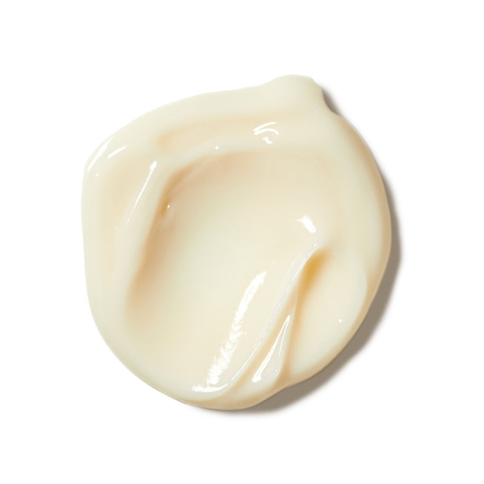 A glossy, smooth-edged smear of Rooted Beautys Purifying De-puffing Eye Gel, with a creamy, antioxidant-rich pale yellow formula on a white background—ideal for brightening dark circles.