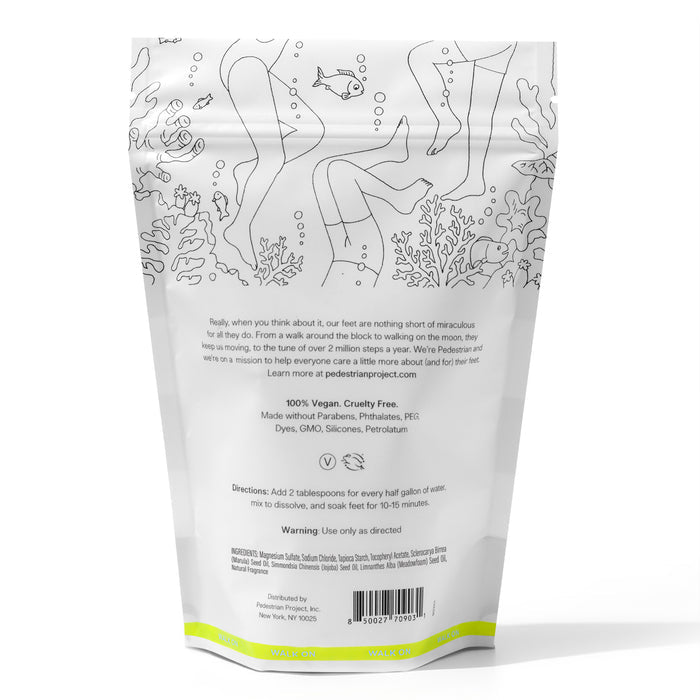 The Purifying Foot Soak by Pedestrian Project comes in a white package featuring outline drawings of people, fish, and coral. Its a vegan, cruelty-free formula without parabens, phthalates, or dyes. Usage directions are included on the packaging.