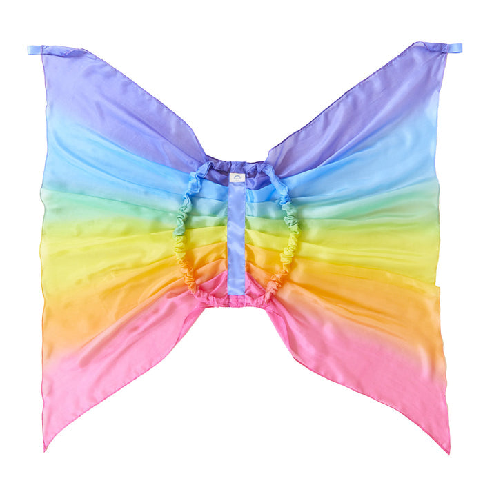 The Rainbow Fairy Wings by Sarahs Silks are made of rainbow-colored sheer fabric, resembling vibrant butterfly wings with purple, blue, green, yellow, orange, and pink hues gathered at the center like mulberry silk—ideal for enchanting dress-up play.
