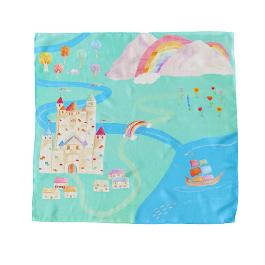 Illustrated on Sarahs Silks Rainbowland Play Map, a whimsical world of fabric showcases a castle, ship on blue waters, and vibrant mountains with rainbows. Curved paths connect scenes of fields and flowers, while playsilks add texture to the trees and houses for imaginative play.
