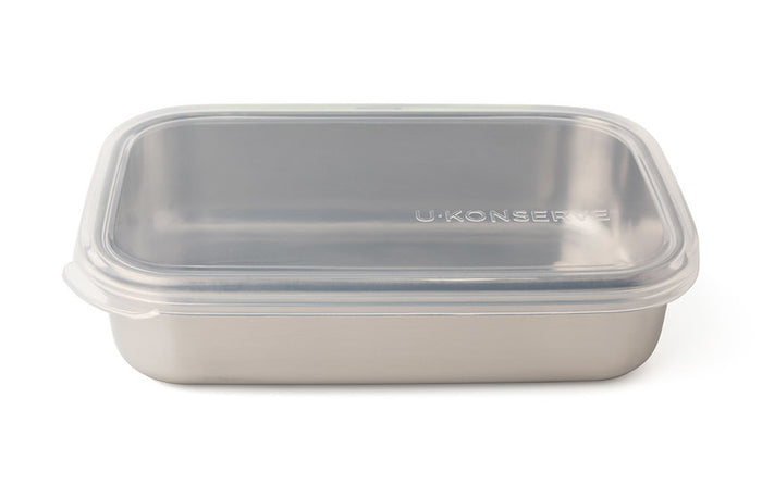 The Rectangle Container by U-Konserve is a stainless steel food container featuring a minimalist design. It includes a transparent, BPA-free lid with U-Konserve embossed on the right side, offering an elegant plastic-free storage solution.