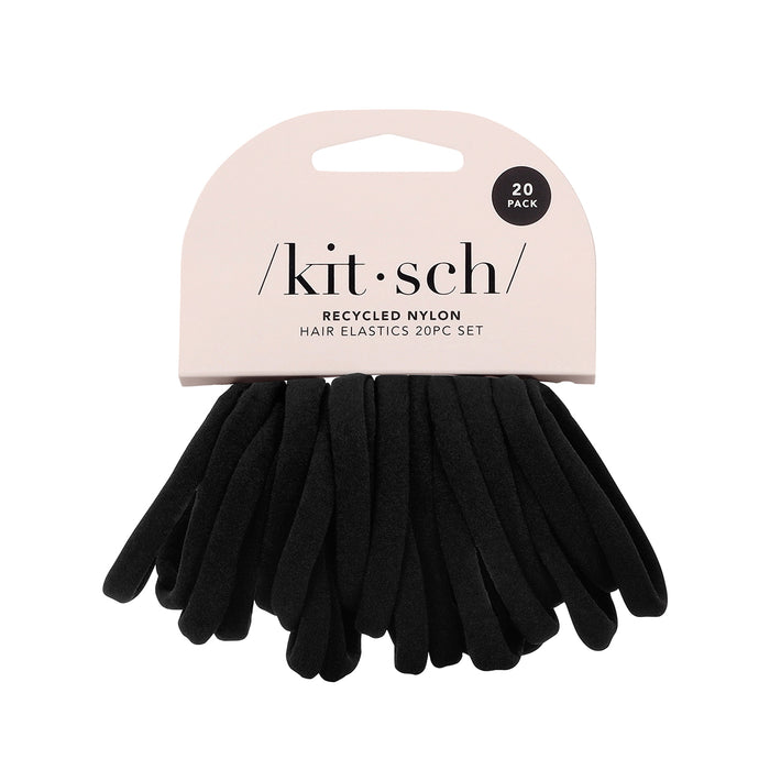 The Kitsch Recycled Nylon Hair Elastics 20pc set features eco-friendly black hair ties made from recycled nylon, neatly packaged on a cardboard holder with a hanging cutout.