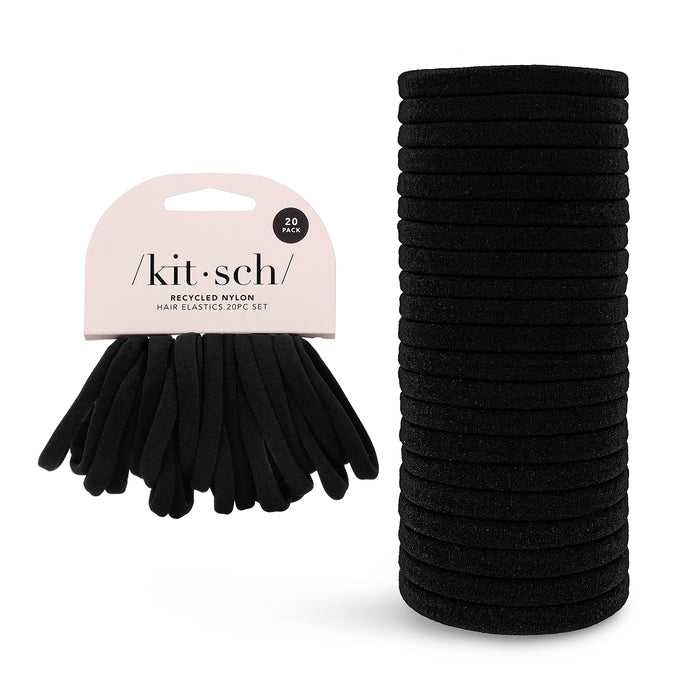 Kitschs Recycled Nylon Hair Elastics are an eco-friendly essential for daily use. The image shows 20 black elastics on a cardboard holder and stacked beside it.