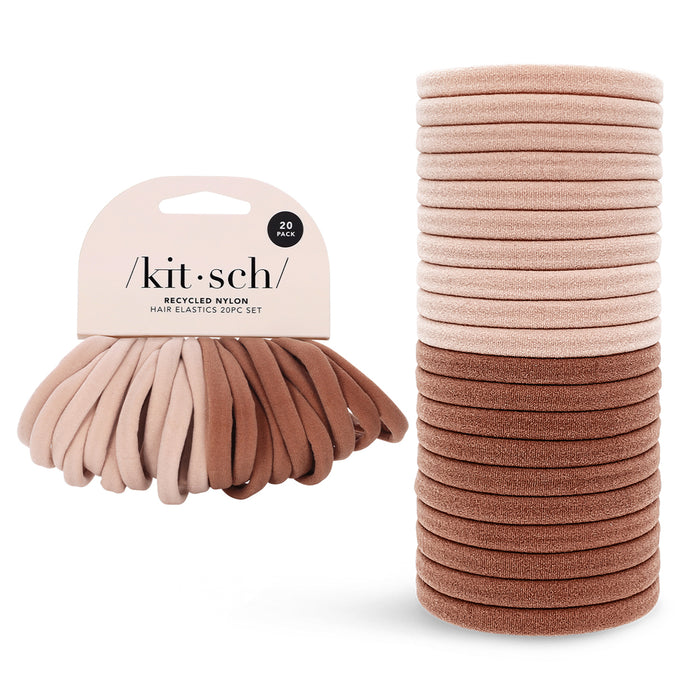 A set of 20 eco-friendly Kitsch Recycled Nylon Hair Elastics in neutral brown tones, bundled with a cardboard label, and stacked neatly, perfect for any occasion.