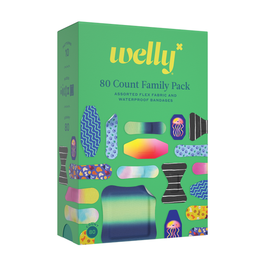A colorful green Welly Refill Box features 80 flex fabric and waterproof bandages with vibrant designs, making it a cheerful addition to any portable first aid kit.