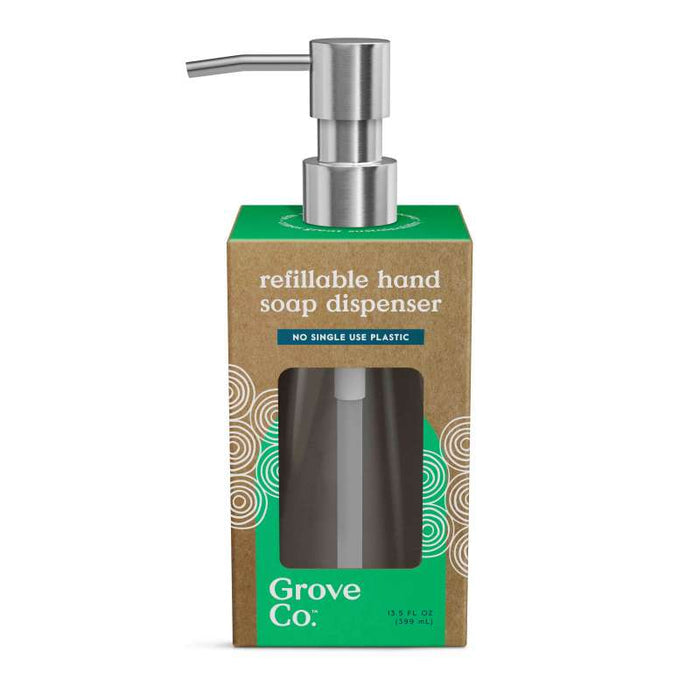 The Grove Co. Refillable Gel Hand Soap Dispenser is packaged in a cardboard box with a cutout displaying the metal pump and bottle. Its green packaging features white text and circular patterns, emphasizing its recyclable design and dedication to minimizing single-use plastic.