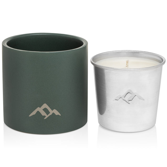 Murphys Naturals Refillable Mosquito Repellent Candle, housed in a silver metal tin with a mountain logo, complements a larger dark green ceramic holder of the same design. The white candle wick is visible, providing an elegant DEET-free way to enhance your space using essential oils.