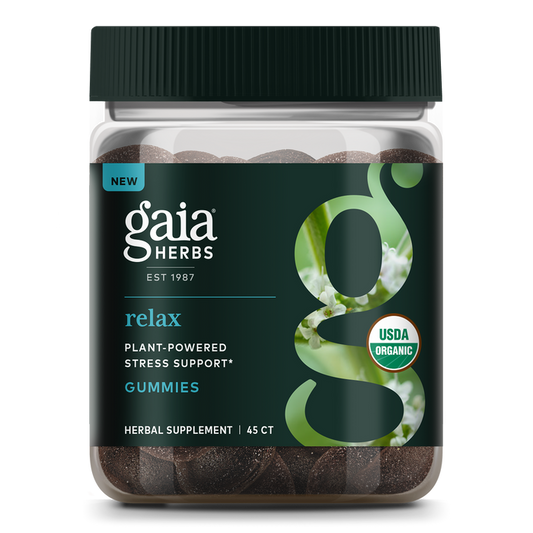 A jar of Gaia Herbs Relax Gummies offers plant-powered stress support with Lemon Balm, featuring a dark green label bearing a large g and flower photo. It is USDA organic and includes 45 gummies.