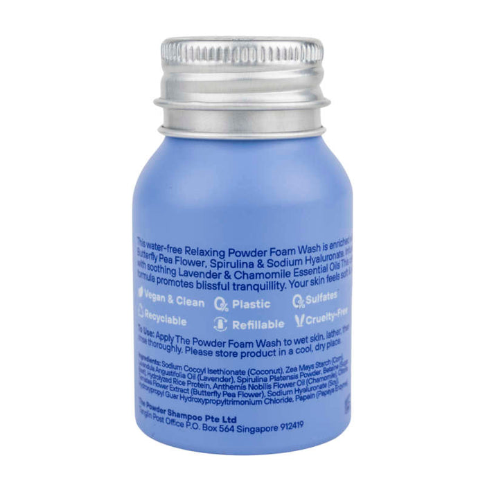 A small blue, recyclable aluminum bottle labeled Relaxing Night Body Foam Wash by The Powder Shampoo highlights its vegan, refillable, and cruelty-free nature with soothing Lavender & Chamomile Essential Oils. Ingredients and a Singapore address are listed at the bottom.