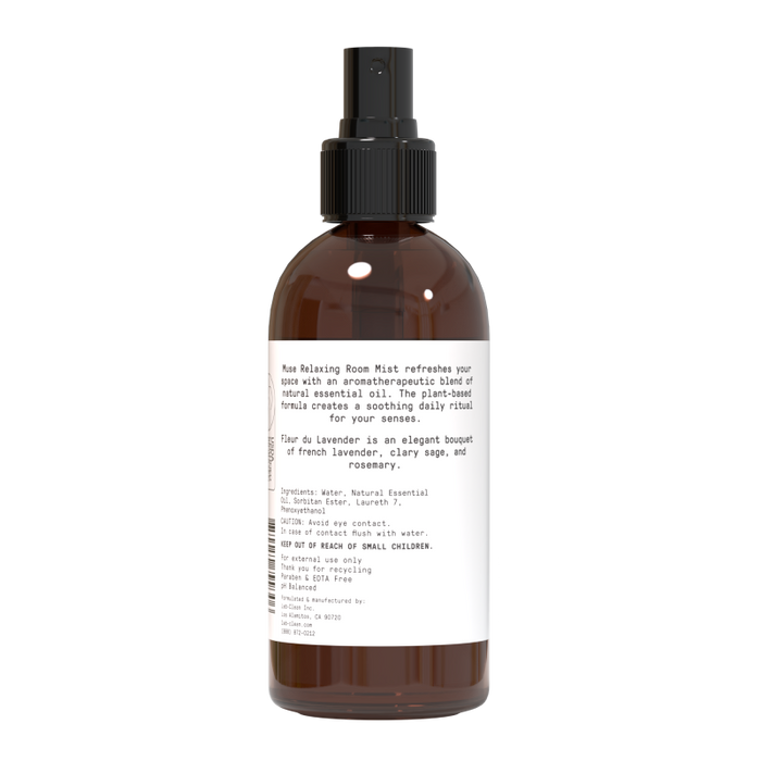 A brown bottle of Relaxing Room Mist by Muse Apothecary with a black nozzle features an aromatherapeutic blend. The label, Rume, showcases a calming mix of natural essential oils. Ingredients and directions are conveniently listed.