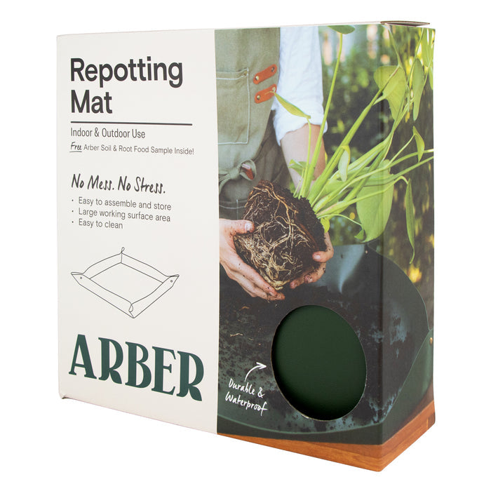 The Arber Repotting Mat packaging features hands managing plant roots, illustrating its easy use. Its eco-friendly and durable design ensures a mess-free experience, ideal for indoor/outdoor use and complements your Organic Soil & Root Food routine perfectly.