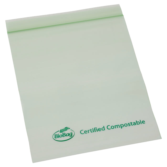 A translucent green BioBag lies flat, showing Certified Compostable text. This eco-friendly option is perfect for those seeking sustainable solutions. The top of the Resealable 1 Quart Food Storage Bag is neatly folded over.