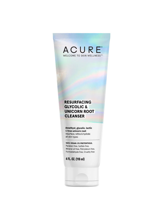 Acures Resurfacing Glycolic & Unicorn Root Cleanser comes in a 4 fl oz (118 ml) tube. The packaging features an iridescent design with the tagline Welcome to Skin Wellness, emphasizing its vegan and free-from formulations.