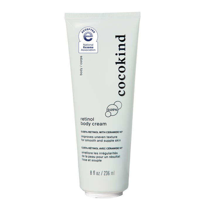 Cocokinds Retinol Body Cream in an 8 fl oz white tube, enriched with ceramide NP and squalane, is a luxurious moisturizer that enhances skin texture and is certified by the National Eczema Association.