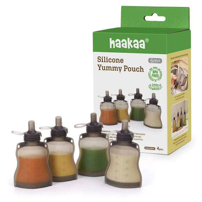 Four colorful Haakaa reusable 100% food-grade silicone baby food pouches, labeled haakaa Silicone Yummy Pouch, promote a self-feeding journey for ages 6 months and up. These BPA-free, eco-friendly pouches are perfect for environmentally conscious families aiming for zero waste.