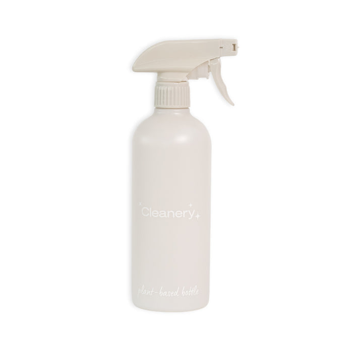 The Cleanery Reusable Cleaning Bottle features a minimalist beige design with a trigger spray nozzle, made from sustainably grown renewable sugarcane for an eco-friendly touch against a plain white background.