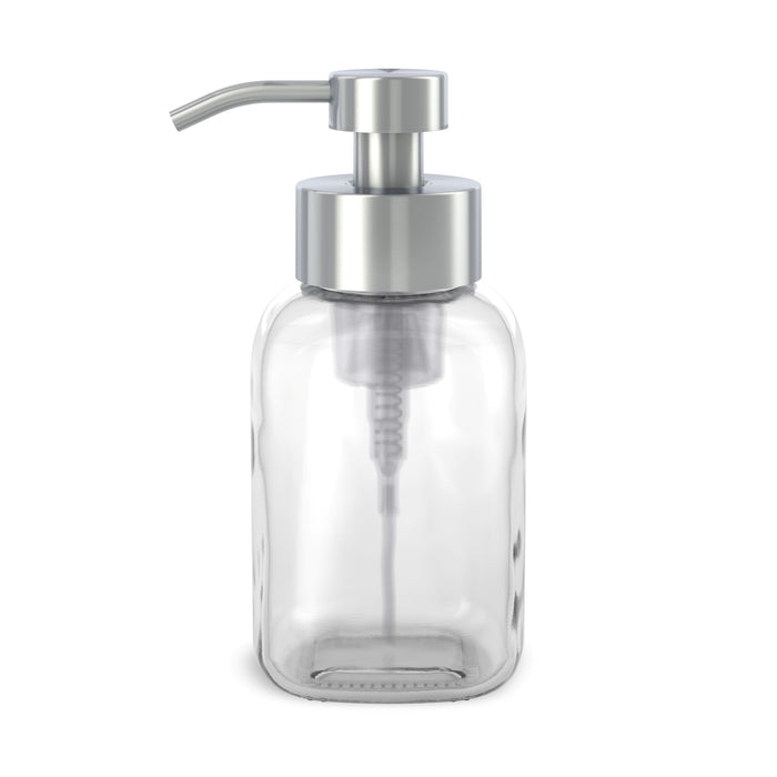 The Reusable Glass Foaming Hand Soap Dispenser by Grove Co. is a modern, sleek, transparent glass bottle with a silver pump and spout. Ideal for foaming soap, this reusable dispenser helps reduce plastic waste and is photographed empty against a white backdrop.