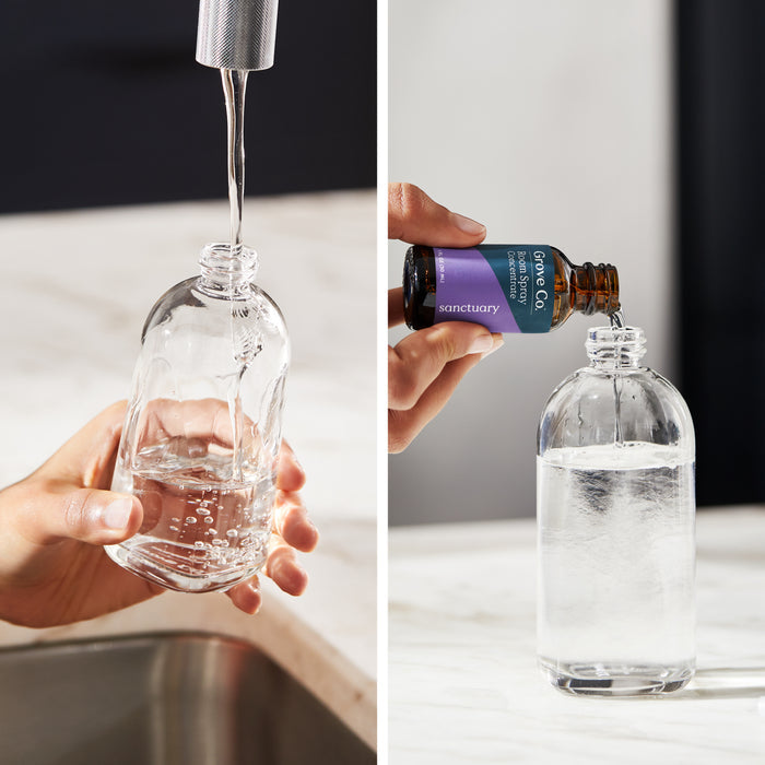 Left: A person pours water into a Grove Co. Reusable Room Spray Bottle over the sink. Right: Sanctuary sustainable room spray concentrate is added to the partially filled clear bottle on a marble surface.