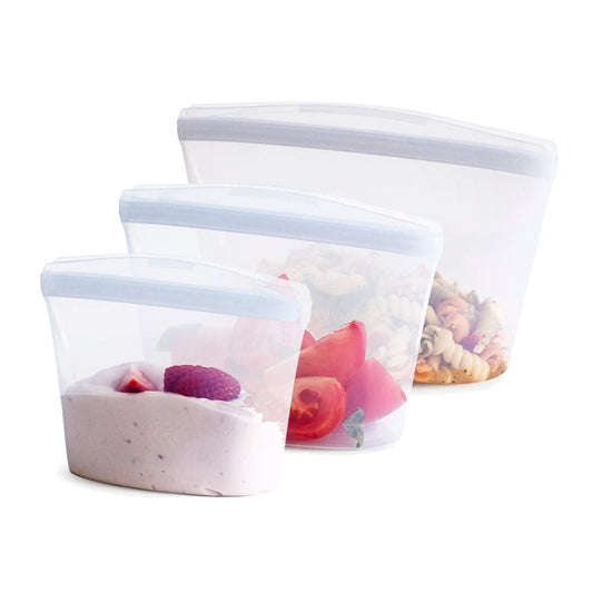 Introducing the Stasher Reusable Silicone Bowl Variety Pack, a set of three transparent, reusable food storage bags in various sizes. Ideal for lunch prep: the smallest holds yogurt and berries, the medium stores sliced tomatoes, and the largest accommodates a delicious pasta salad.