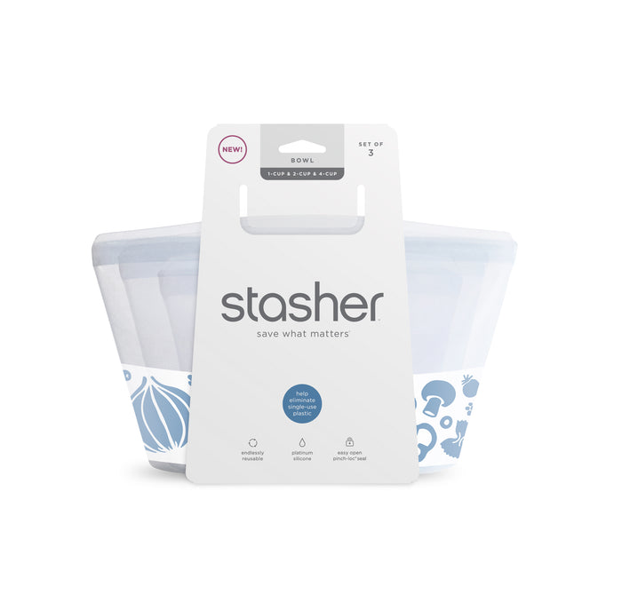 Stashers Reusable Silicone Bowl Variety Pack includes three eco-friendly storage bags, ideal for lunch prep. Each features fruit and veggie designs with a white label showing the brand name and icons indicating microwave safety.